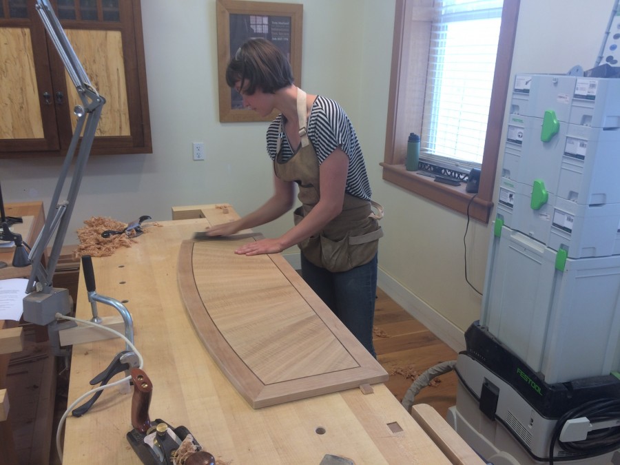 Chantel working on a group project, a beautiful sofa table made out of cherry and gum wood.