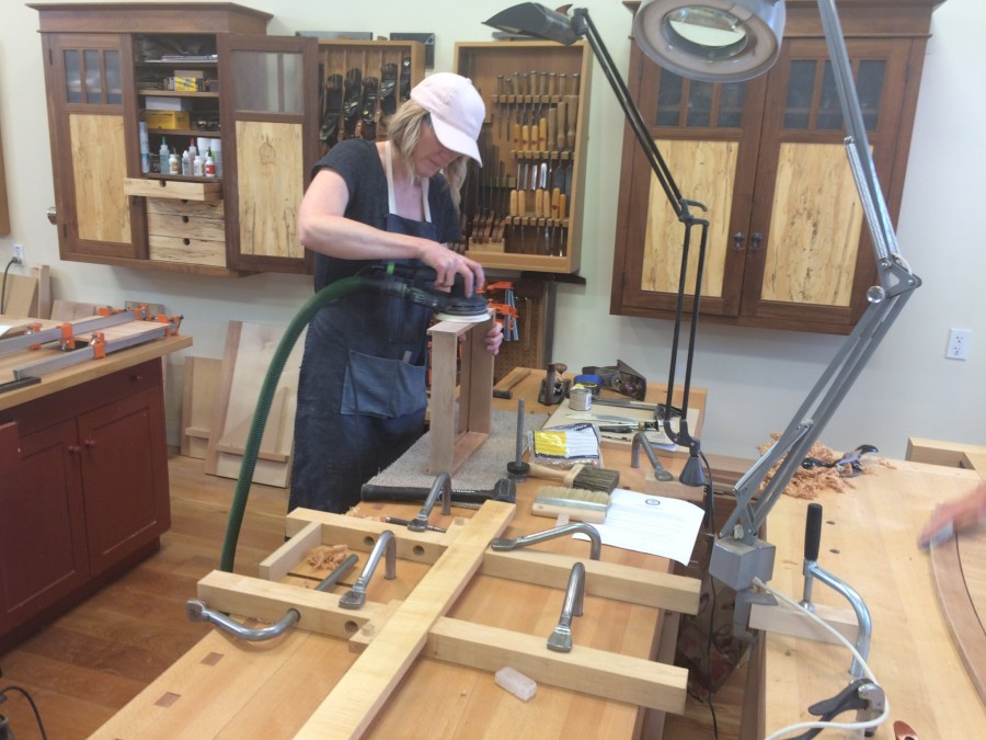 Carrie sanding the drawer for the bow-front sofa table.