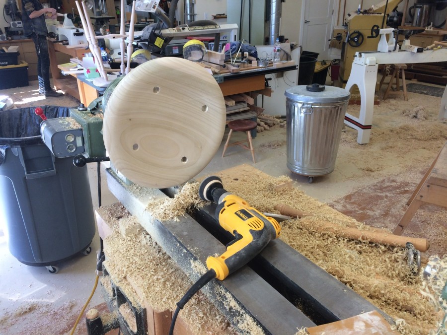 A completed seat after sanding at the lathe. Notice the mess in my shop.